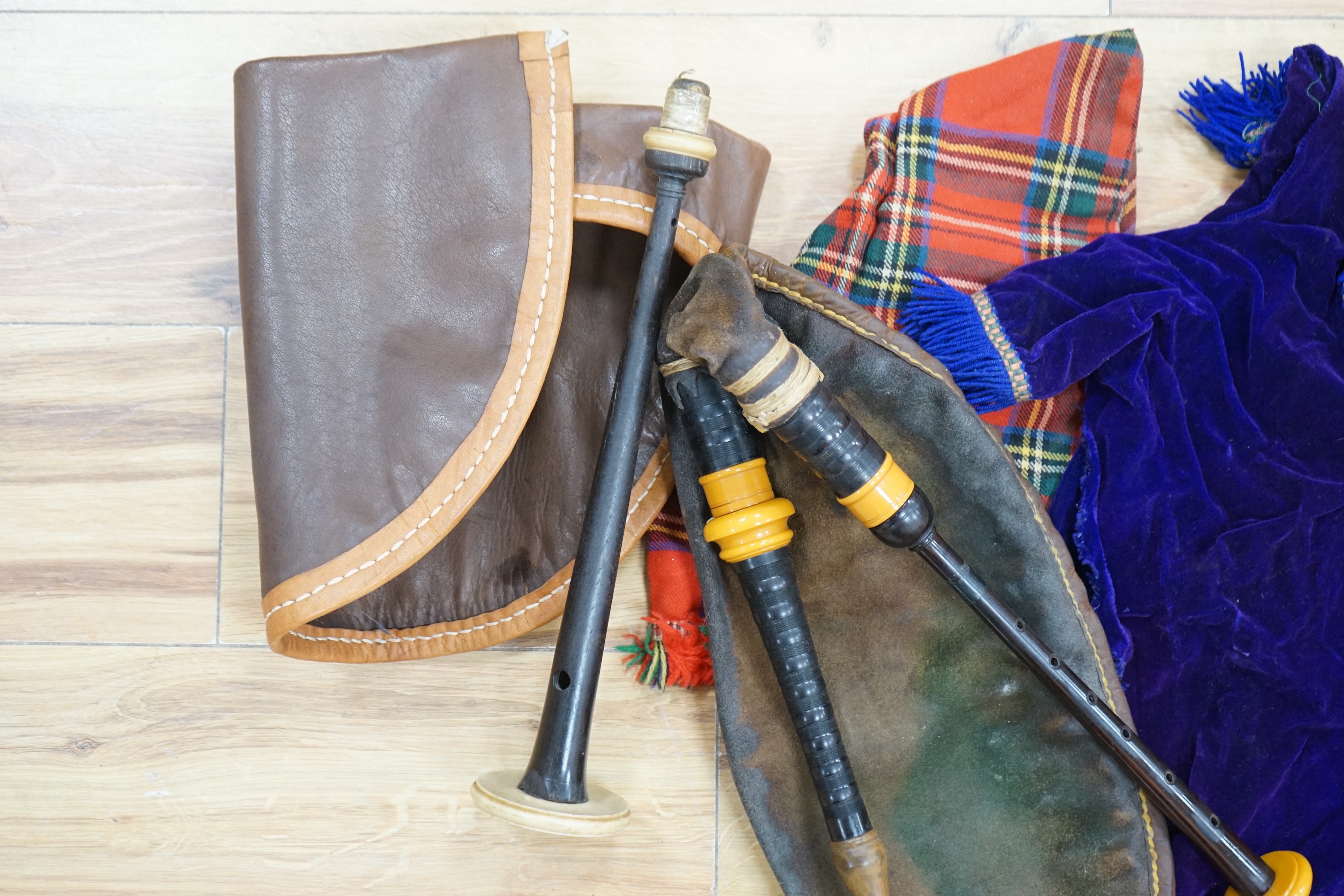 Two practice sets of bagpipes, one cased